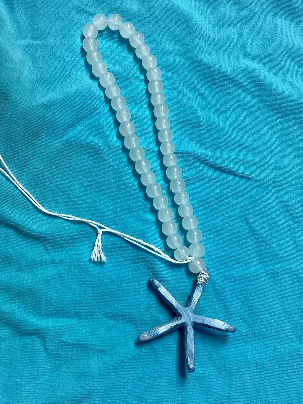 White Beaded Necklace with Blue Starfish Pendant